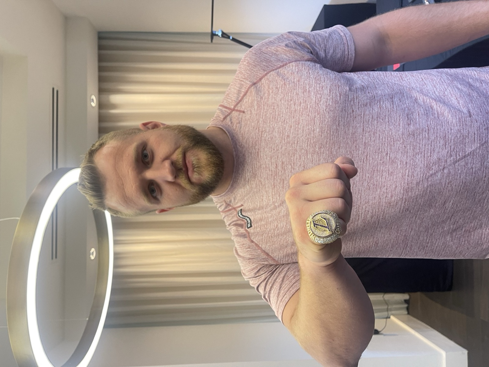 Coach Taylor Ramsey wearing a championship ring